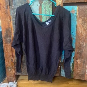 black cardigan, sinched at the bottom